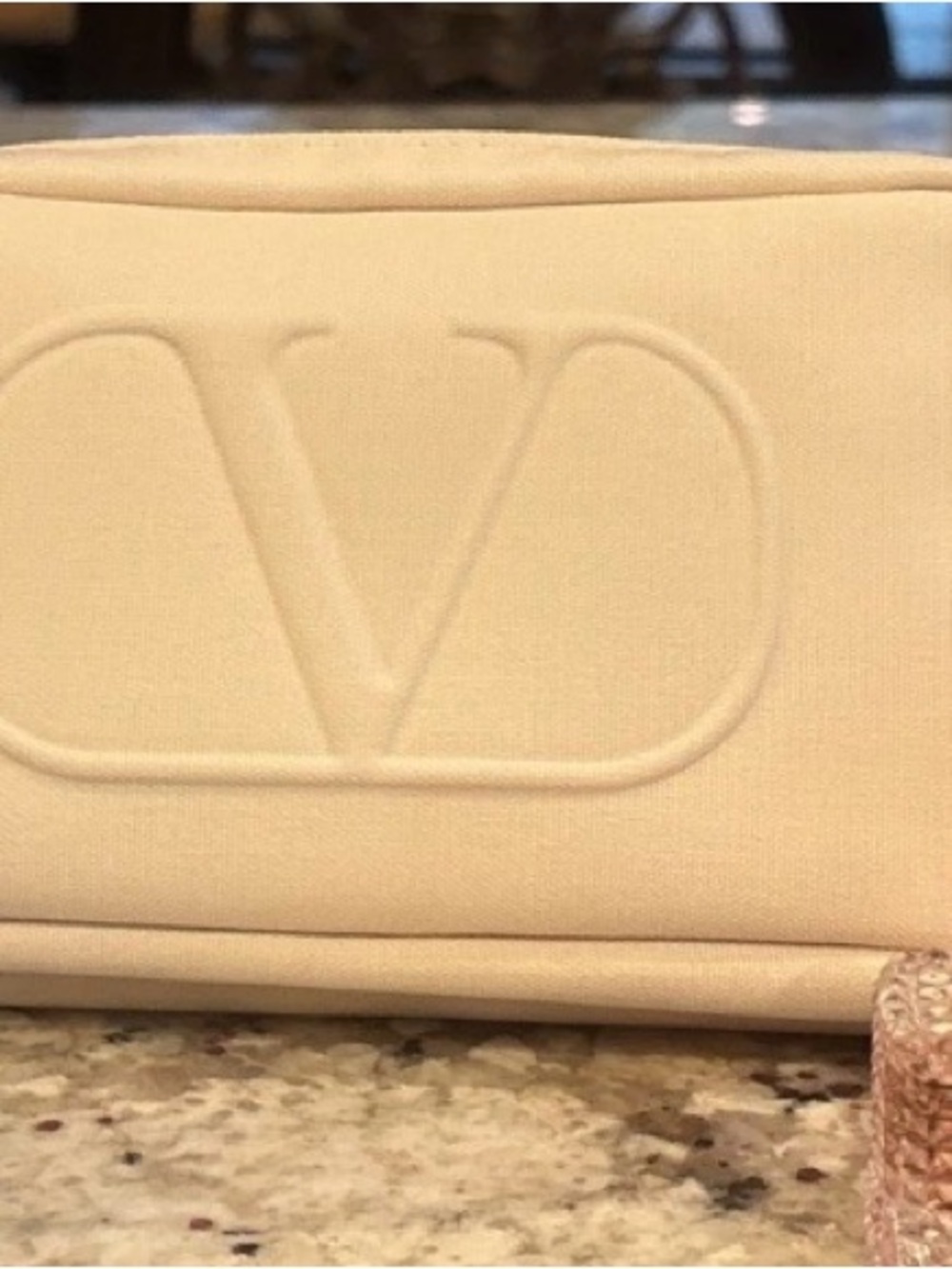 Valentino Garavani Cream Embossed V Logo Clutch